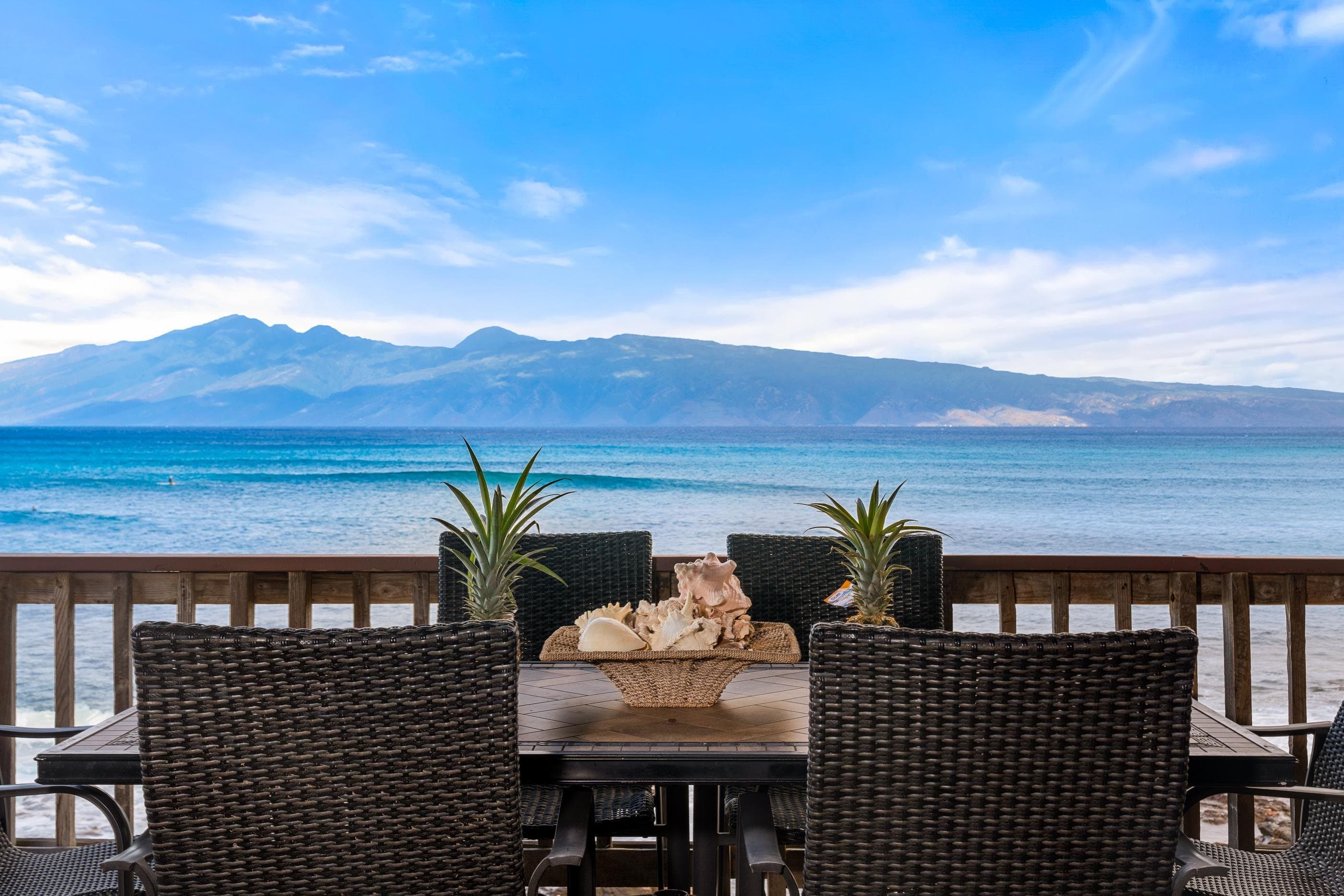 Outdoor dining on the deck, Molokai across the channel at the horizon